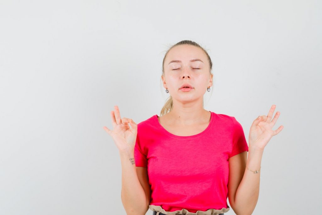 Individual practicing mindful breathing for calm focus.